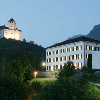 Evening view of Haus Gutenberg with Gutenberg Castle in the background