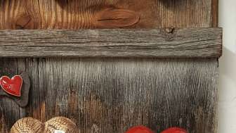 Hearts on wooden board