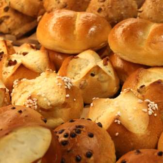 Freshly baked rolls and sweet pastries in the display of the Balu Bakery