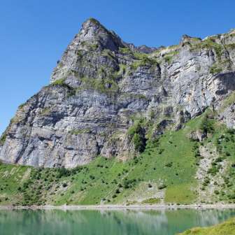 View of the Oberblegisee with mountain scenery