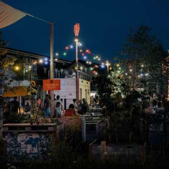 Evening atmosphere under colourful lights in the Zeughausgarten