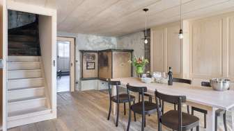 Dining room with dining table and large box stove